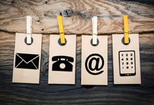 Symbole für E-Mail, Telefon, Homepage und Smartphone